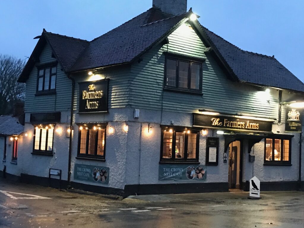 farmers arms pub exterior lit up at evening